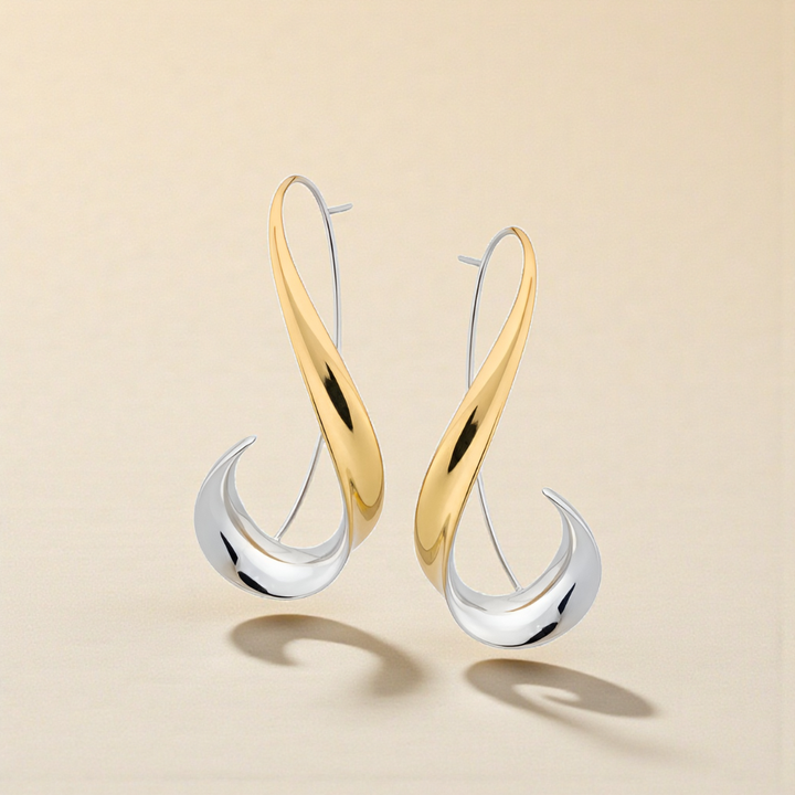 Joias femininas: brincos modernos pendentes em prata e dourado. Acessório sofisticado para um toque de elegância.