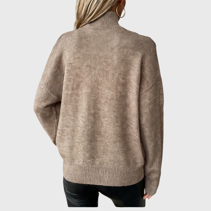 Suéter feminino casual e elegante, gola alta e ombro aberto, peça versátil para o inverno.