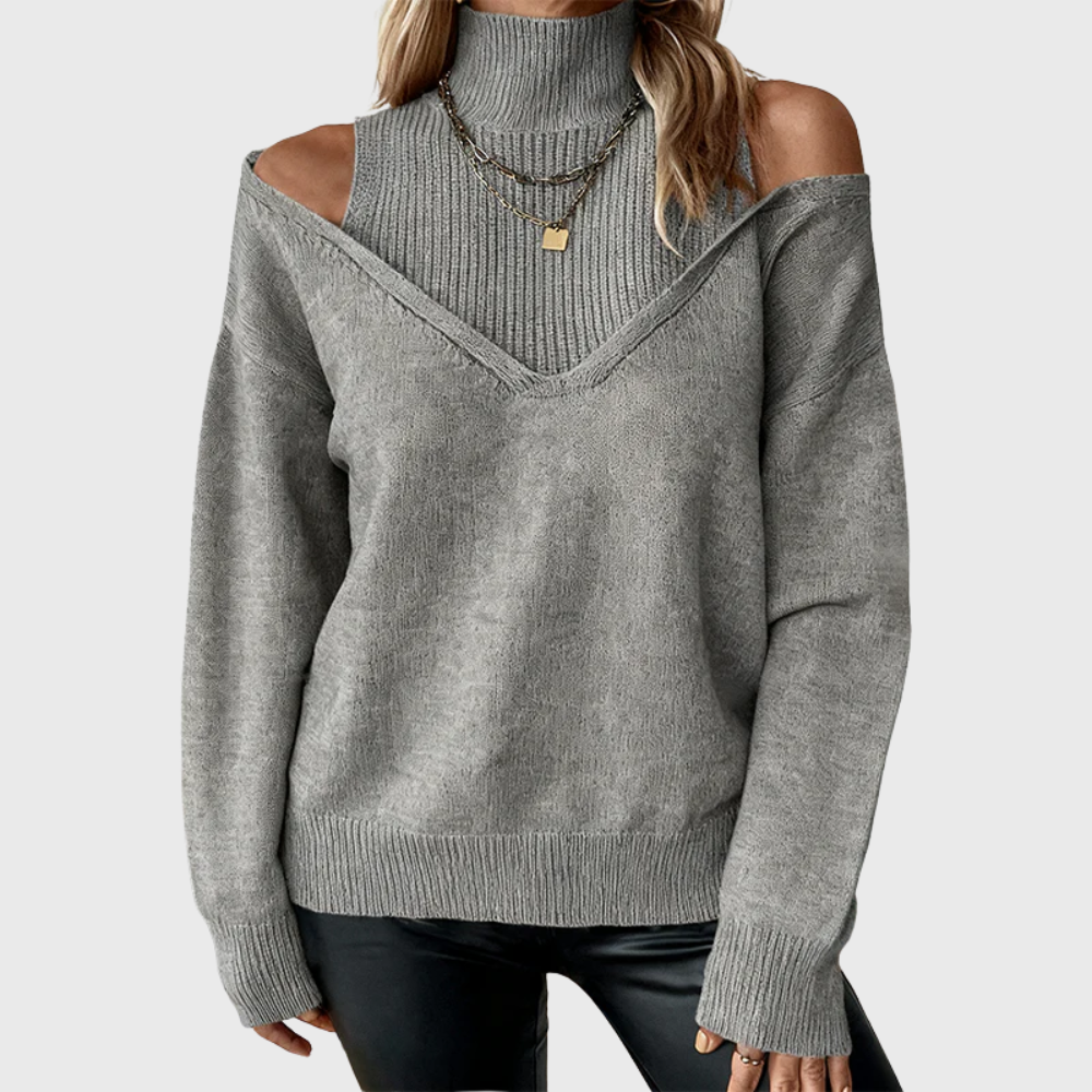 Moda inverno: suéter feminino com gola alta e ombro aberto, peça-chave para um look chique e casual.