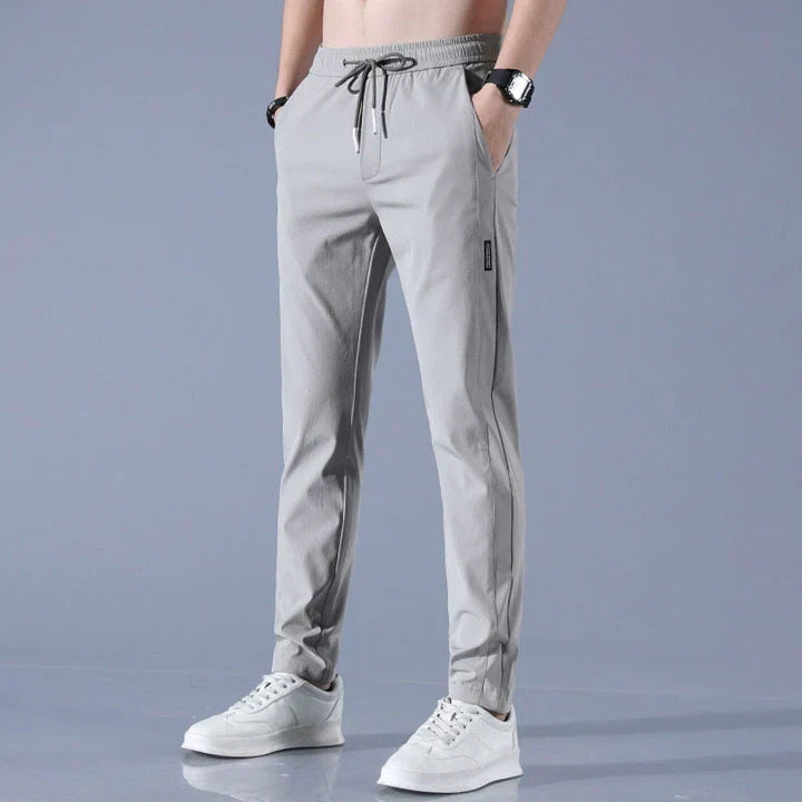 Calça esportiva masculina de verão, elástica, leve e seca rápido, ideal para viagem.