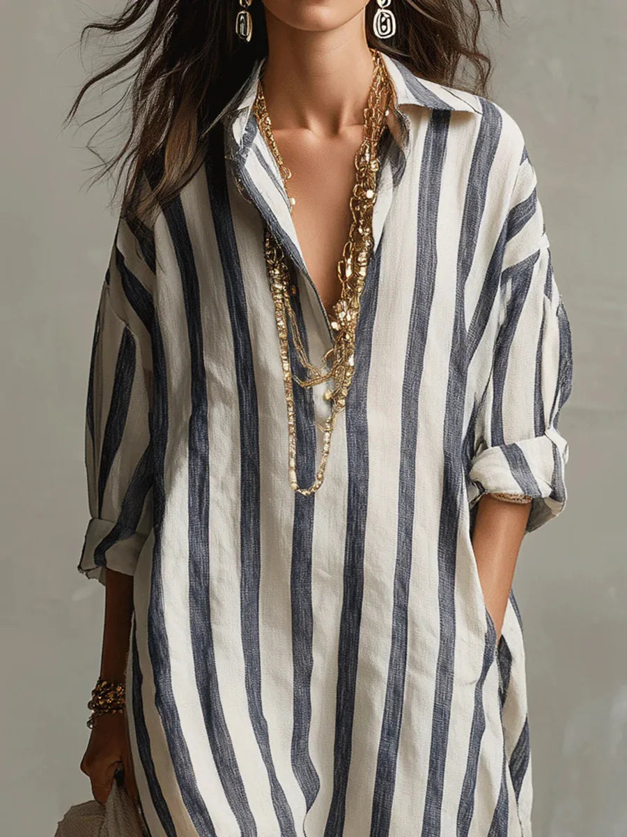 Vestido camisero feminino de estilo descontraído. Manga três quartos e decote V, ideal para o conforto no verão.
