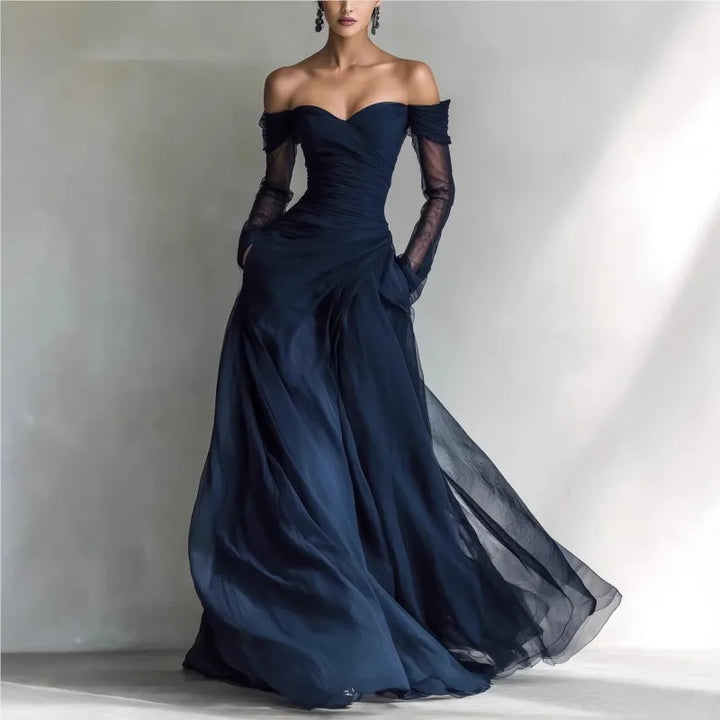 Vestido de festa longo azul feminino, ombros à mostra, ideal para casamentos. Elegância e conforto.
