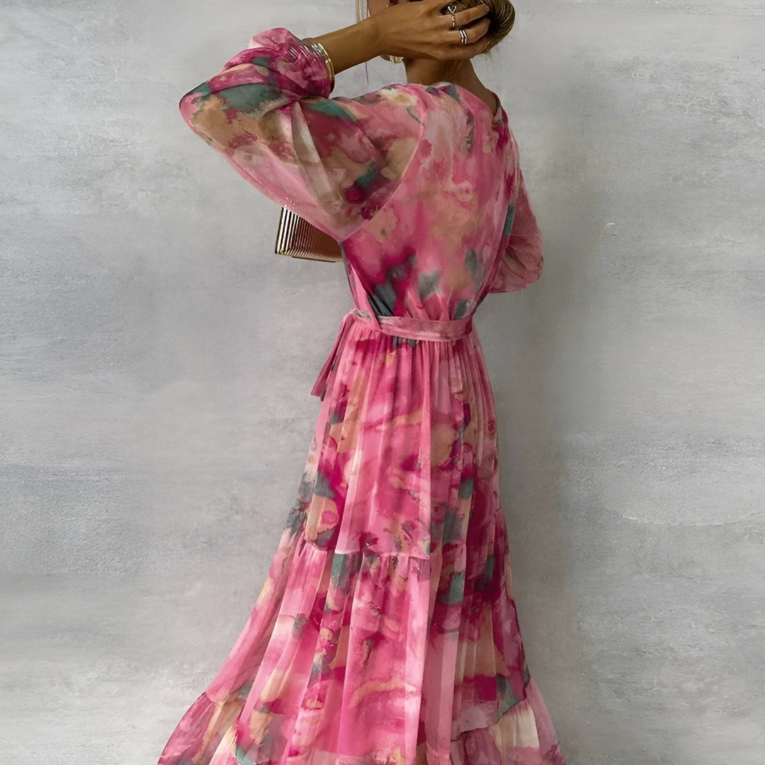 Vestido floral rosa feminino com decote V e manga longa, ideal para verão, casual e estilo boho.