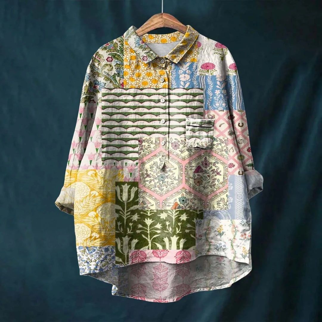 Detalhe da estampa floral vibrante em camisa feminina leve de manga longa. Design elegante para moda primavera-verão.