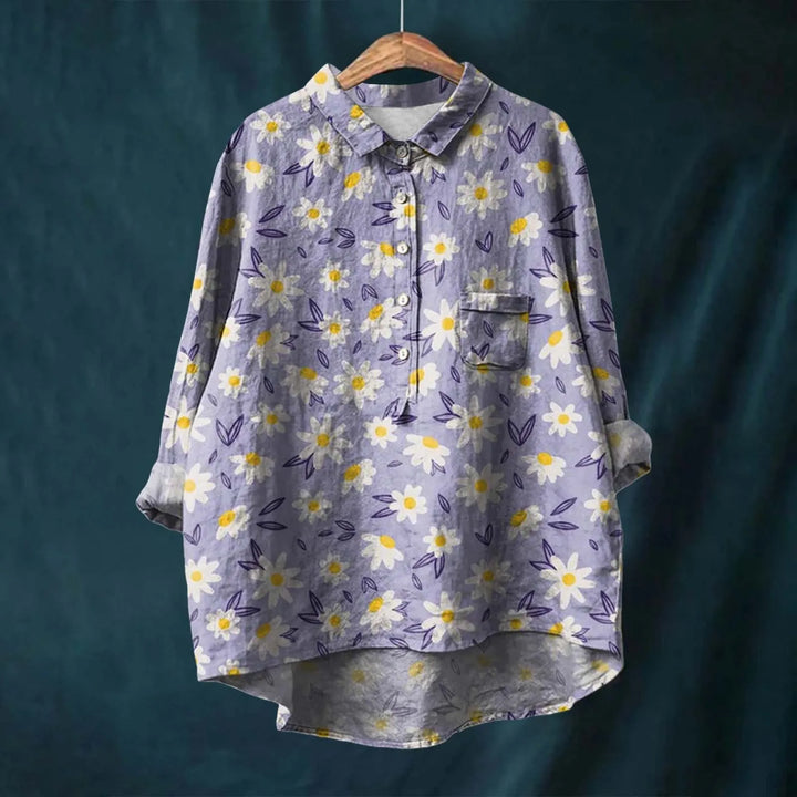 Blusa floral feminina solta e leve, garantindo conforto e um toque de elegância casual para seus dias.