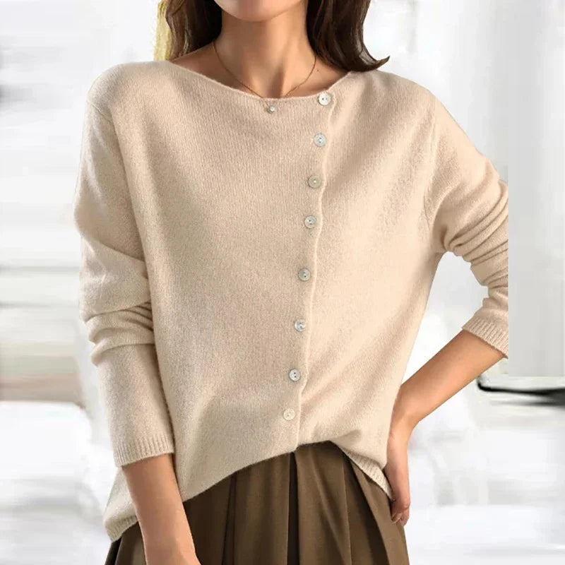Casaco de malha feminino Alfonsa, com zíper lateral que adiciona um toque elegante e moderno.