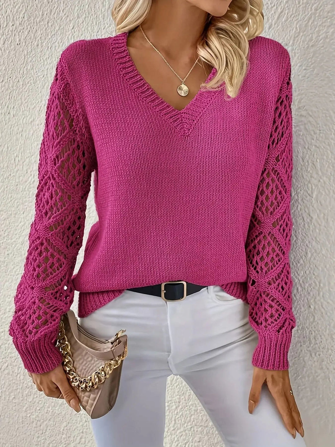 Blusa feminina de malha com decote V, perfeita para um look casual chic de outono/inverno.