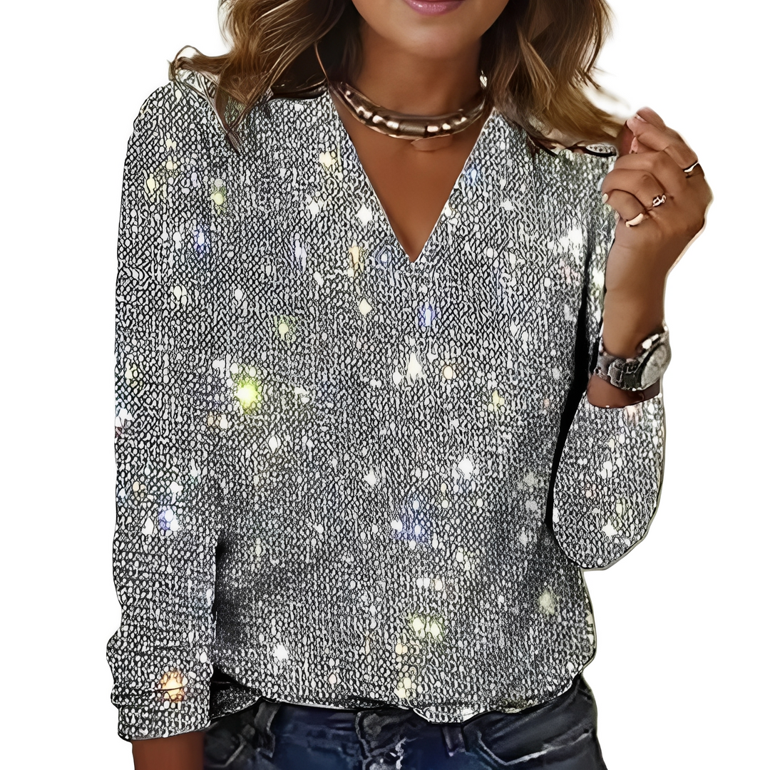 Blusa feminina Caroline com brilho, confortável e versátil para looks elegantes de dia e noite.