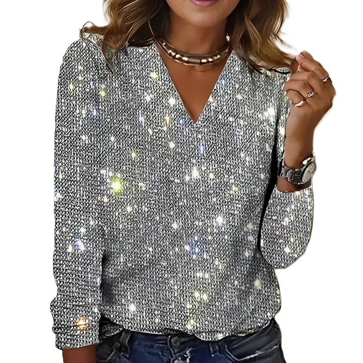 Blusa feminina Caroline com brilho, confortável e versátil para looks elegantes de dia e noite.