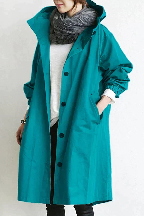 Jaqueta feminina oversized com capuz, perfeita para dias chuvosos. Sobretudo elegante e confortável.