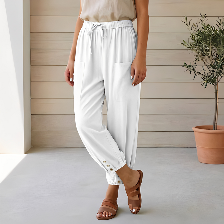 Calça feminina versátil de cintura alta. Modelo amplo, perfeito para looks casuais e elegantes de verão.