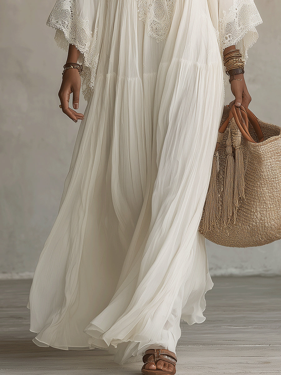 Vestido longo branco feminino com decote V profundo. Peça essencial de verão, casual chic e fluida para a praia.