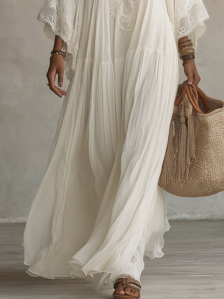 Vestido longo branco feminino com decote V profundo. Peça essencial de verão, casual chic e fluida para a praia.
