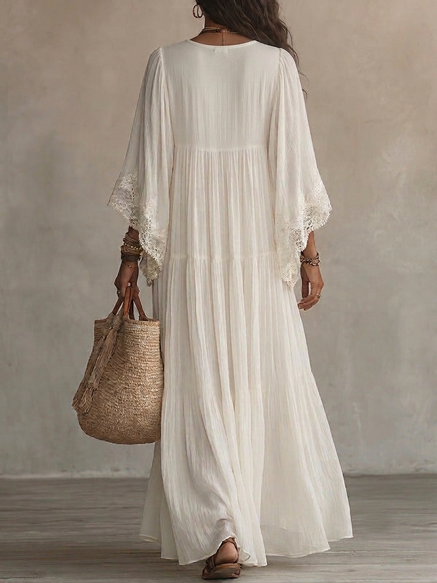 Vestido longo branco feminino com decote V profundo, perfeito para verão e praia. Fluido e casual chic.