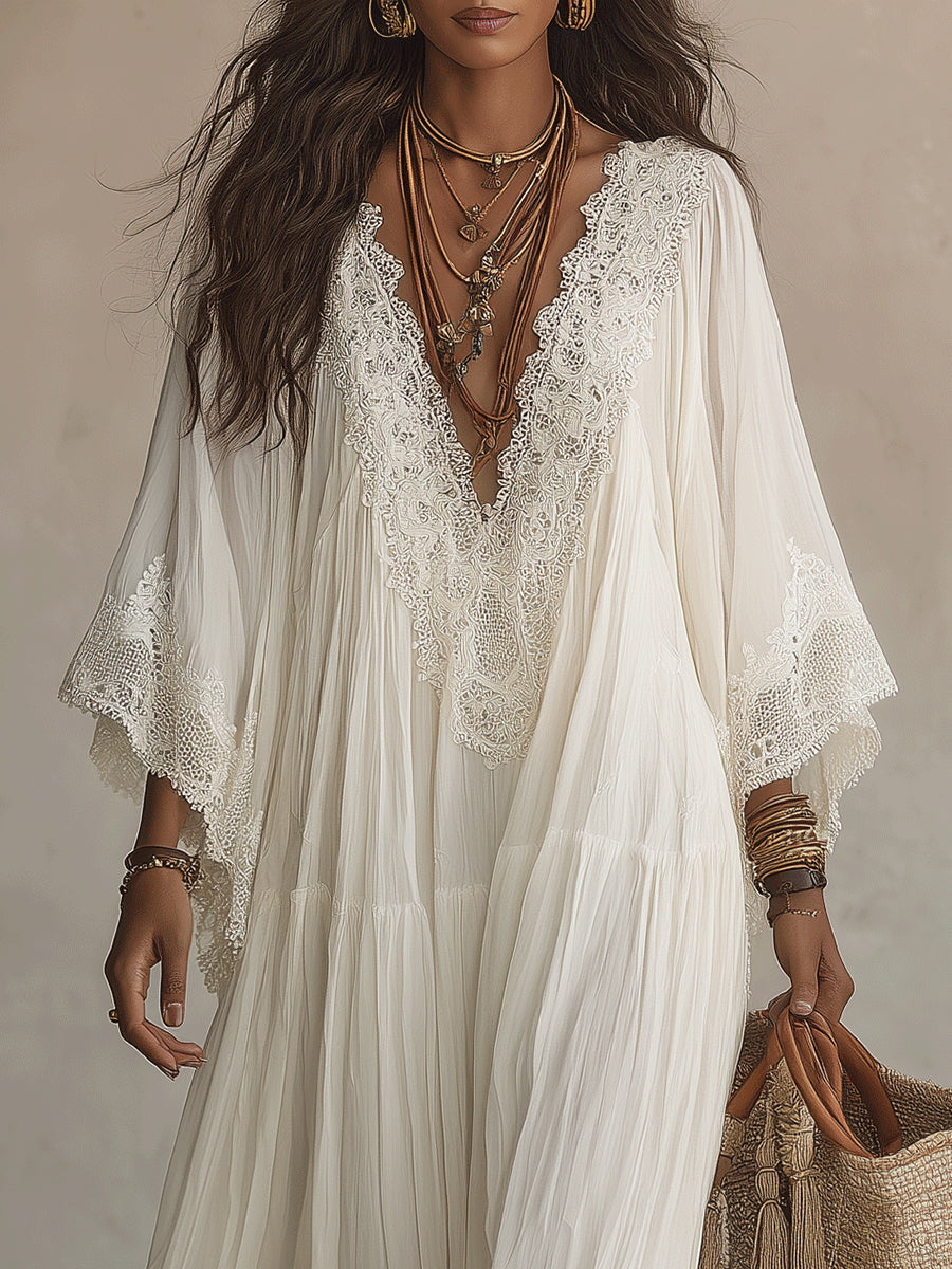 Vestido longo branco fluido com decote V profundo e manga morcego. Confortável e elegante para a moda feminina de verão.