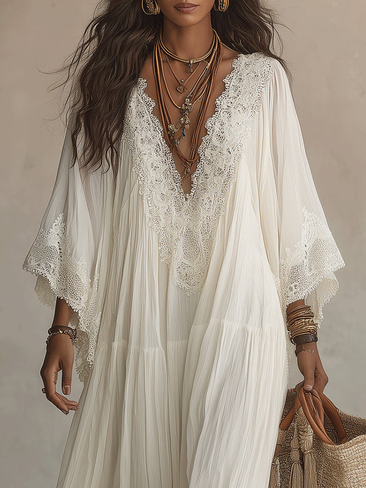 Vestido longo branco fluido com decote V profundo e manga morcego. Confortável e elegante para a moda feminina de verão.