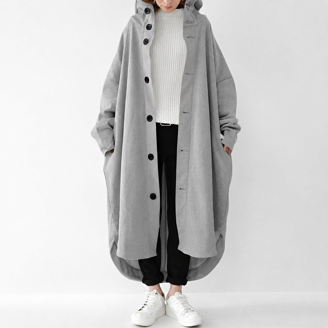 Clássico trench coat feminino longo, solto, atualizado para um estilo casual moderno e elegante.