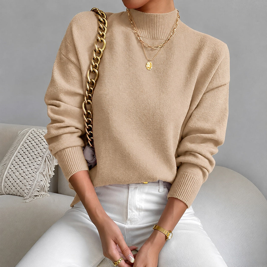 Suéter feminino elegante de gola média, ideal para moda inverno. Conforto e estilo casual chic.