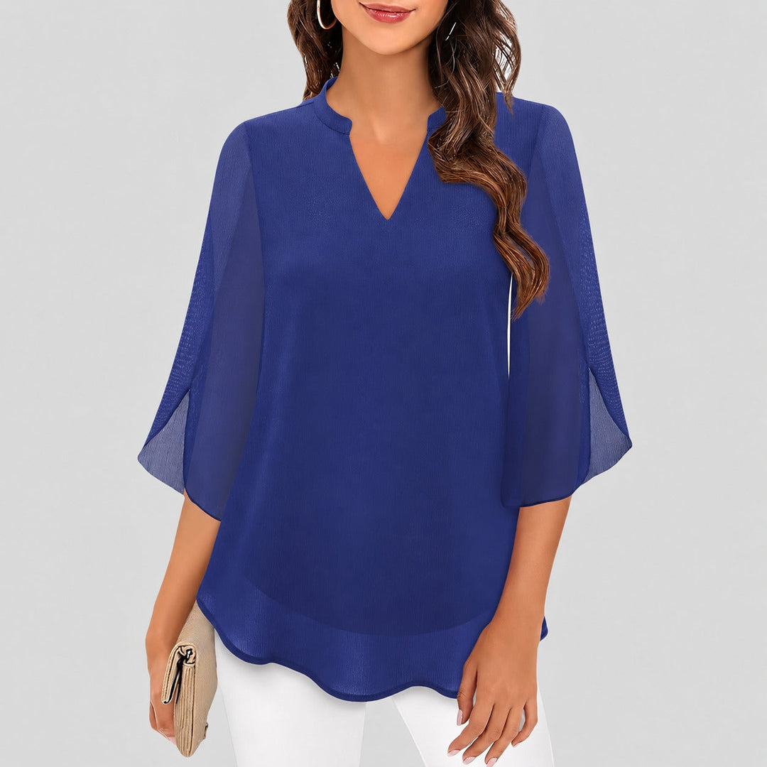 Blusa feminina arejada com fendas nas mangas, versátil para o verão. Conforto e estilo em diversas cores.