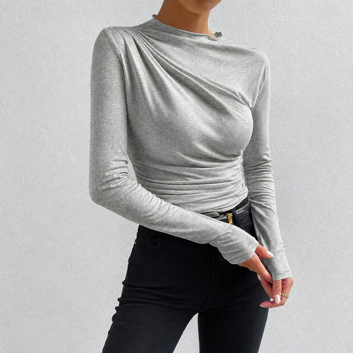 Blusa feminina elegante e confortável, manga longa com franzido sutil, ideal para o dia a dia.