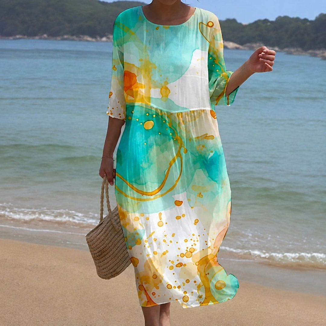 Vestido feminino midi fluido de verão, estampa vibrante, ideal para looks casuais e chiques.