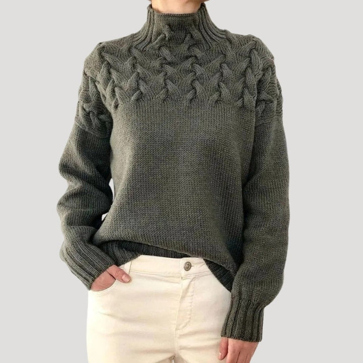 Mantenha-se quente e elegante com esta camisola de malha feminina, gola alta e detalhes de tranças.