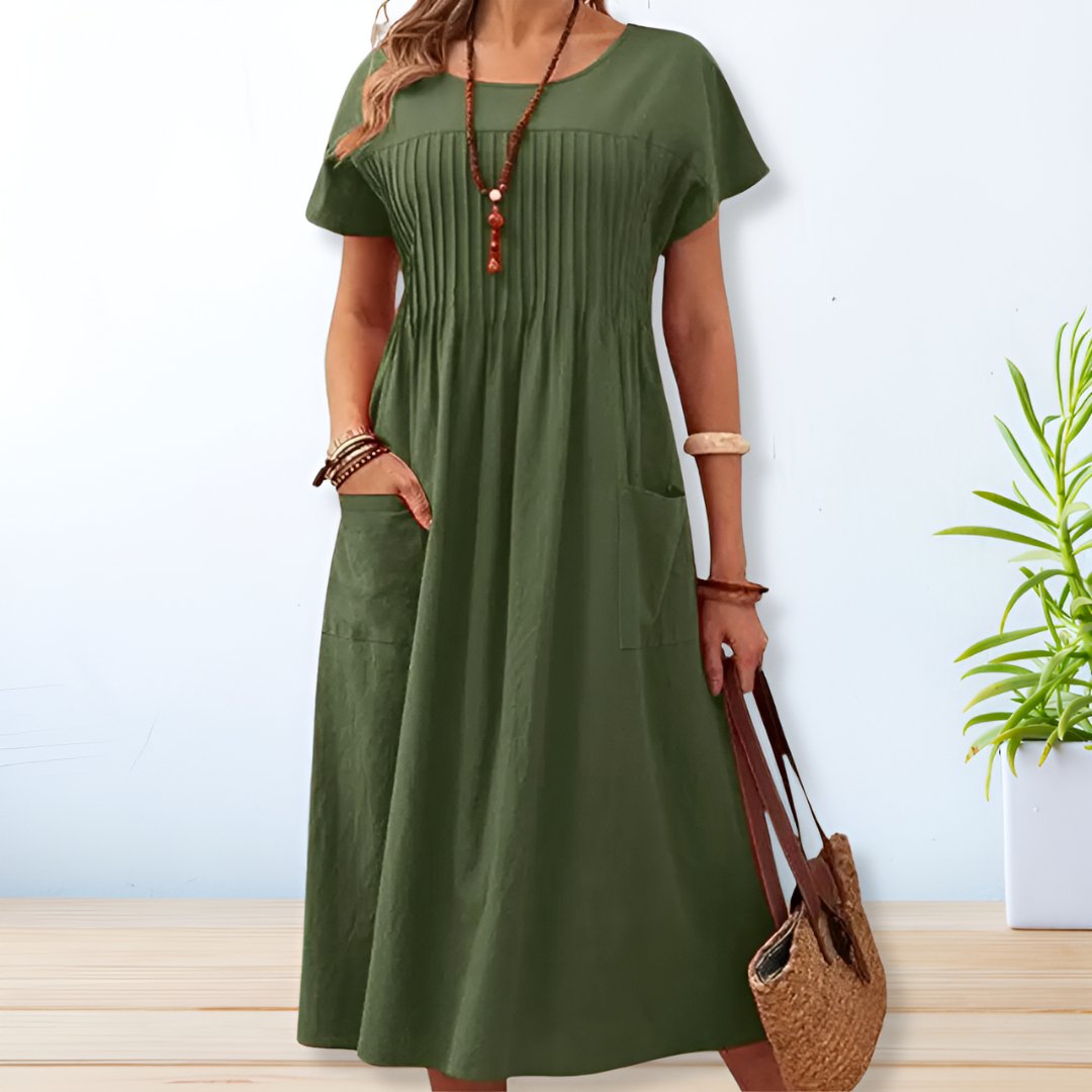 Vestido feminino Leona midi relaxado para o dia a dia, com bolsos. Perfeito para o verão com estilo casual e conforto.