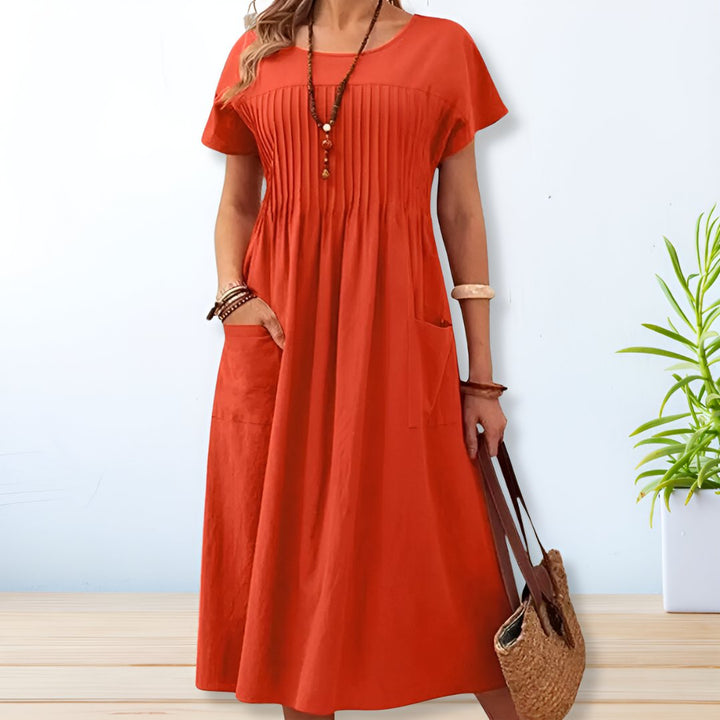 Vestido midi Leona feminino em cores vibrantes, tendência casual para o verão. Conforto e estilo relaxado para o dia a dia.