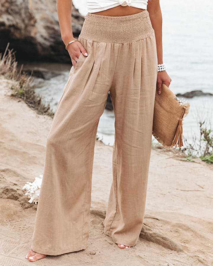 Calças de praia femininas Lily, perna larga e fluida, estilo boêmio. Perfeitas para moda verão e beachwear.