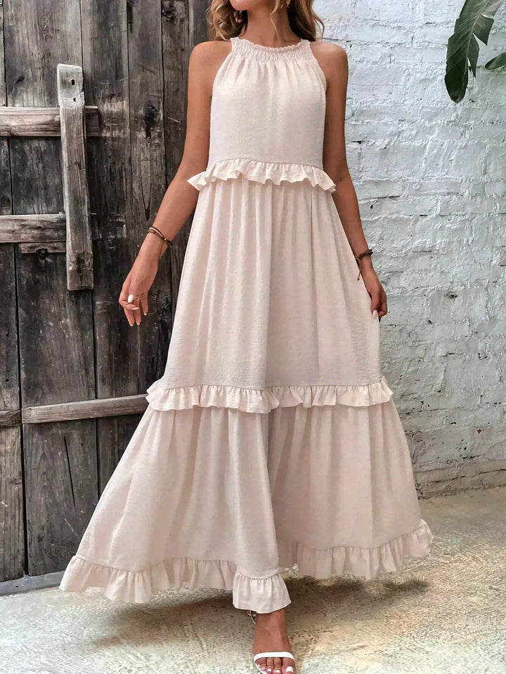 Vestido de verão longo feminino, babados fluidos e alças finas. Elegância para qualquer ocasião.