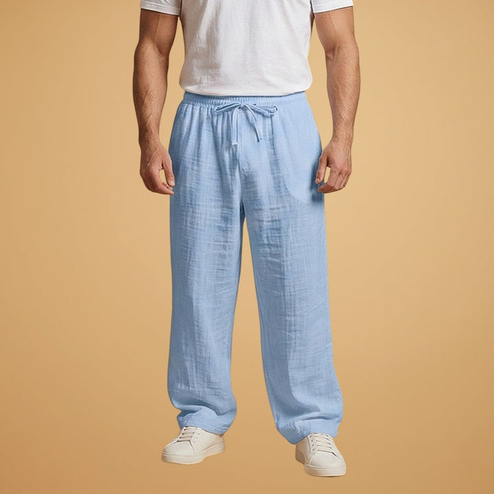 Calças de linho para homem, perna larga e cintura elástica. Estilo elegante e casual, ideal para verão.