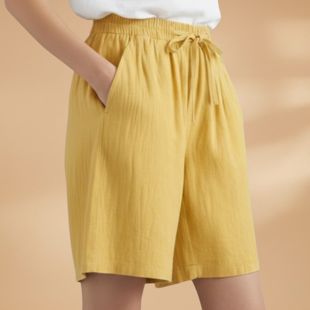Moda verão: Bermudas femininas confortáveis até ao joelho, cintura elástica.