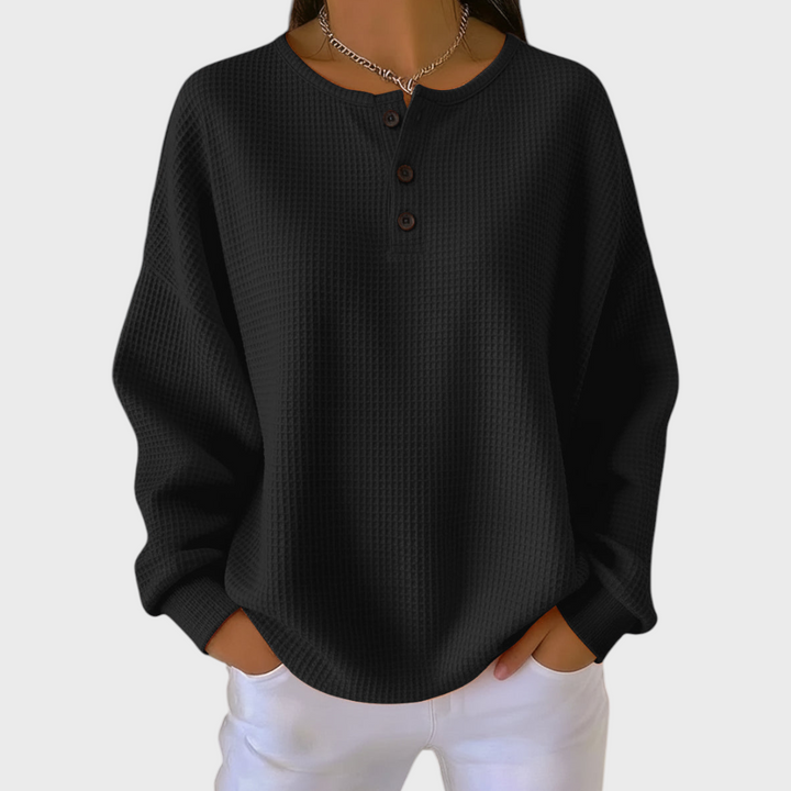 Camisola de malha feminina xadrez. Botões e manga comprida para um look casual de outono/inverno.