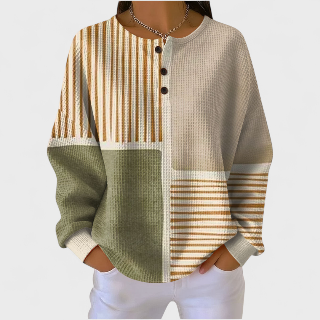 Camisola de malha xadrez feminina com botões. Manga comprida para conforto e estilo na transição.