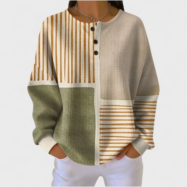 Camisola de malha xadrez feminina com botões. Manga comprida para conforto e estilo na transição.