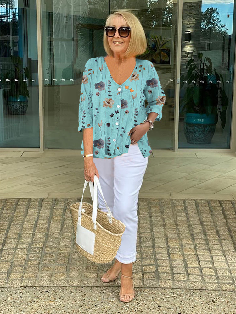 Blusa feminina elegante com estampa floral colorida, perfeita para primavera/verão e estilo casual chique.