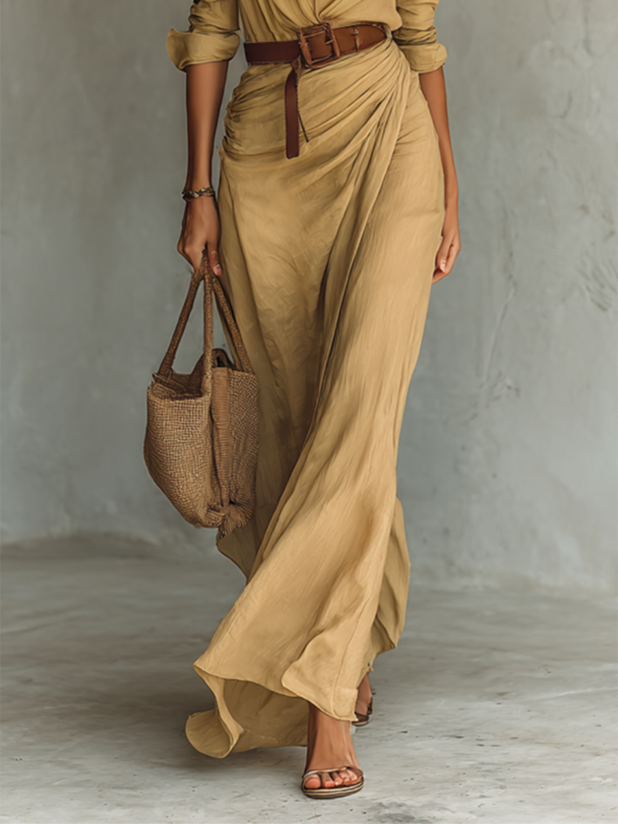 Vestido longo feminino elegante, destacando a lapela e cinto. Peça chic de moda feminina.