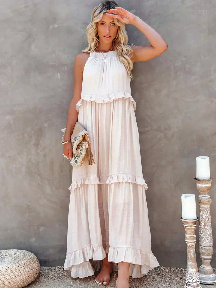 Vestido longo feminino elegante com babados e alças finas. Ideal para verão e festas.