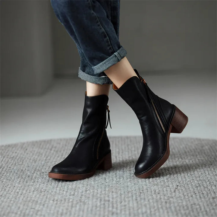 Botas femininas cano médio pretas, elegantes e confortáveis, perfeitas para o dia a dia e moda feminina.