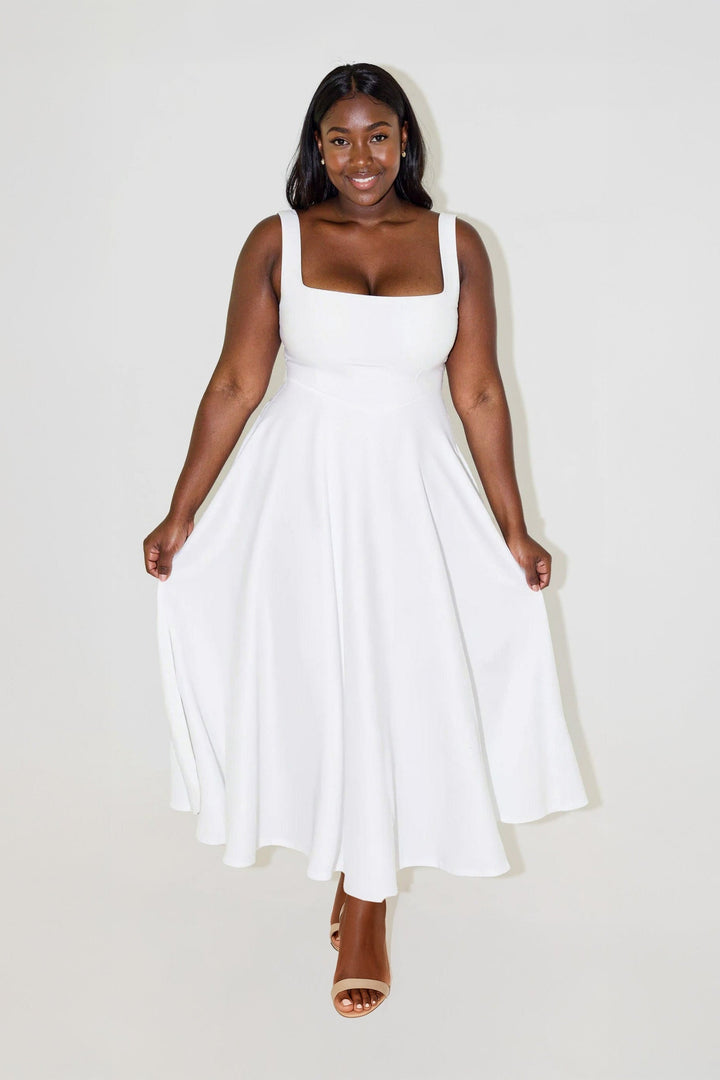 Vestido midi feminino com decote quadrado. Estilo elegante e confortável, perfeito para a moda verão.