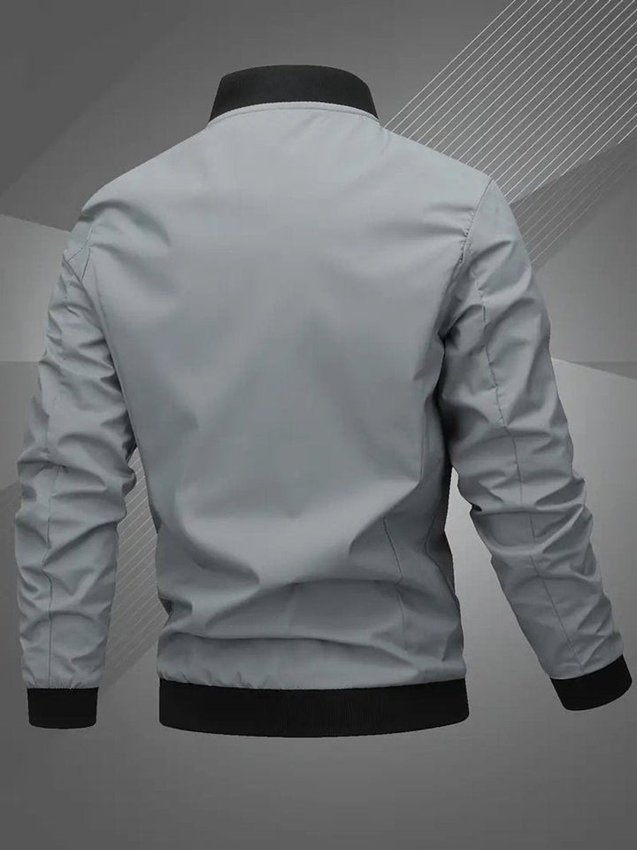 Blusão bomber masculino moderno, gola baseball, estilo urbano. Ideal para outono/primavera.