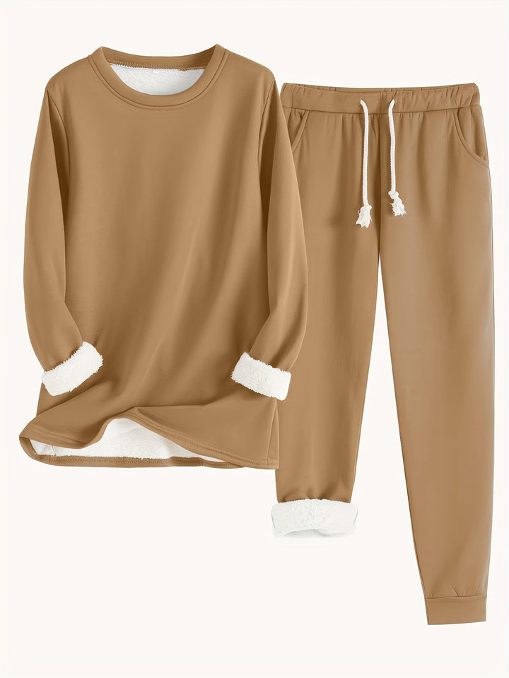 Blusa de moletom do conjunto feminino, com decote redondo e caimento relaxed para uso diário.