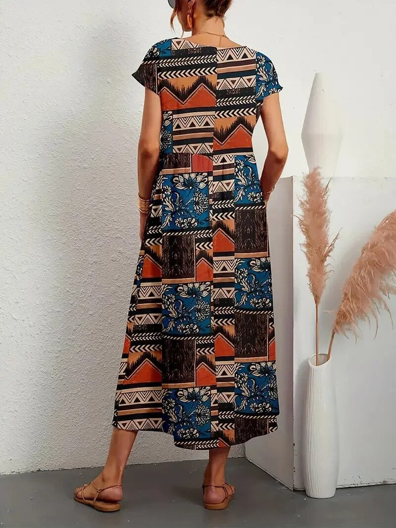 Vestido floral de verão feminino, com manga curta e corte A. Peça essencial para o guarda-roupa de mulher.