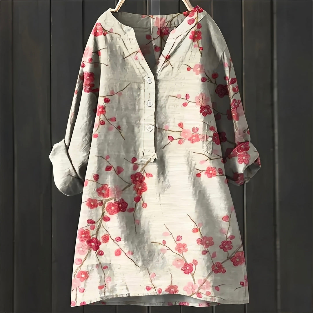 Blusa floral feminina elegante, tecido confortável. Ideal para primavera/verão.