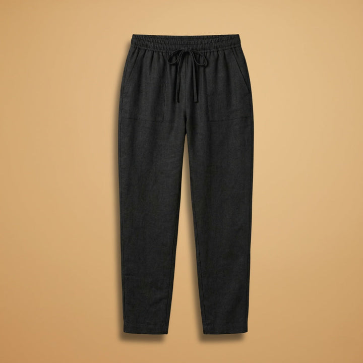 Calças de linho fluidas femininas, cintura elástica, cor bege. Perfeitas para verão e conforto casual.