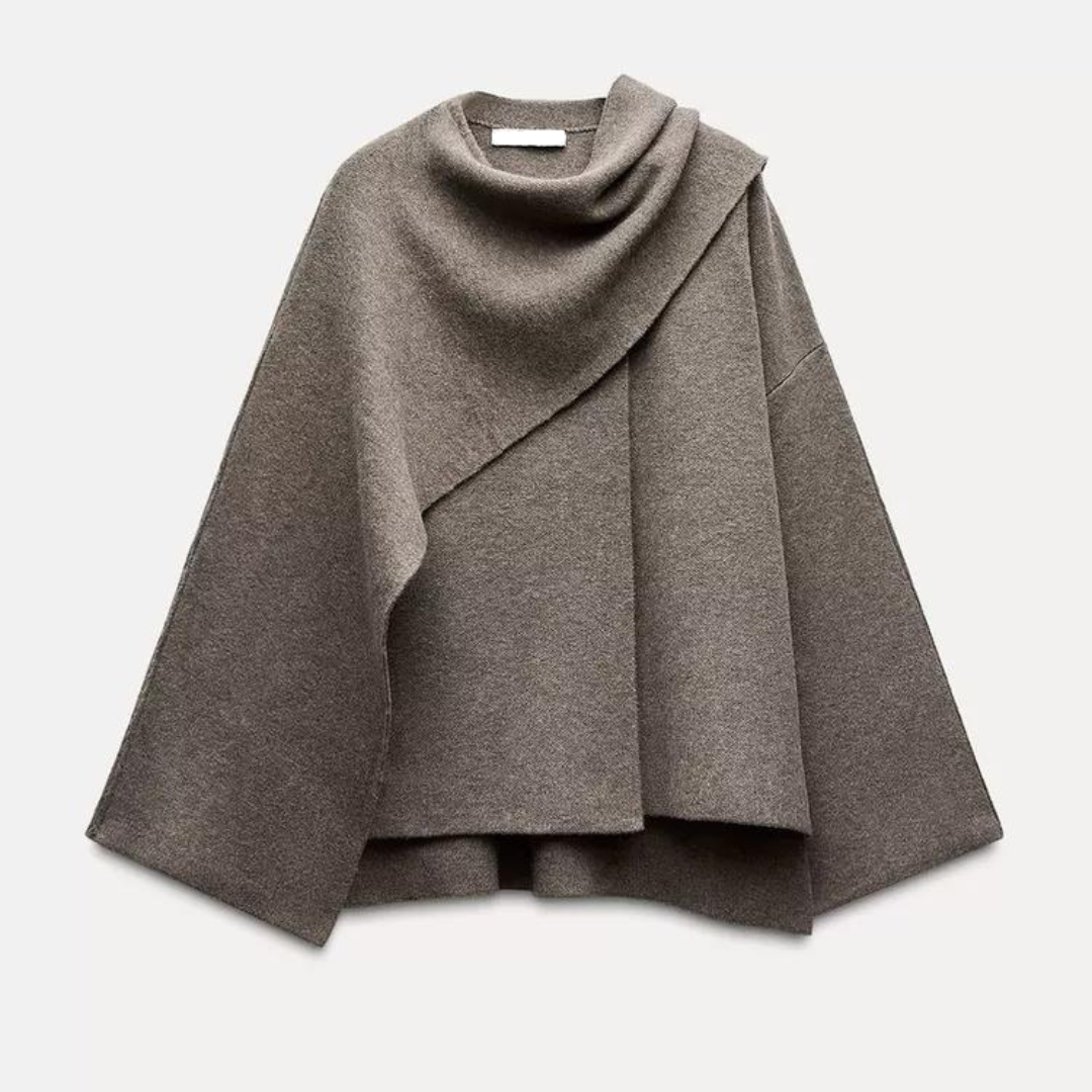 Poncho de lã para mulher, estilo assimétrico com gola ampla. Peça de moda feminina elegante e aconchegante.