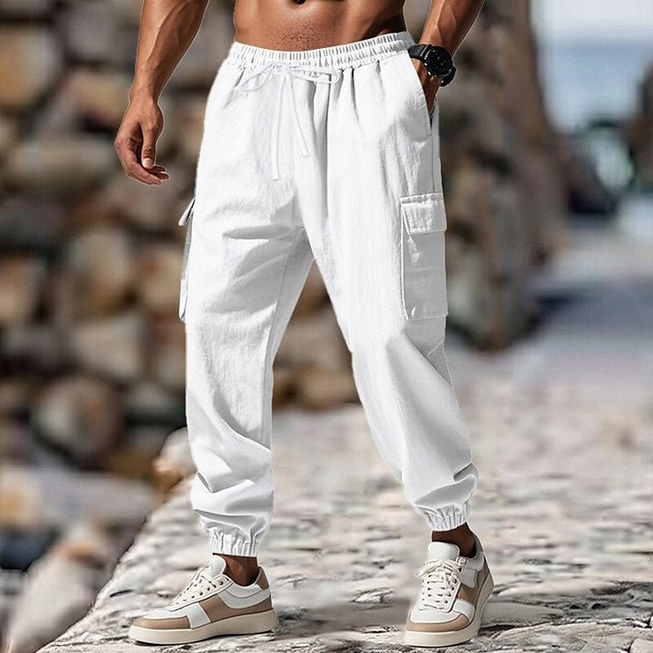 Calças cargo jogger masculinas com cós elástico, cordão ajustável e bolsos cargo, para estilo e praticidade.