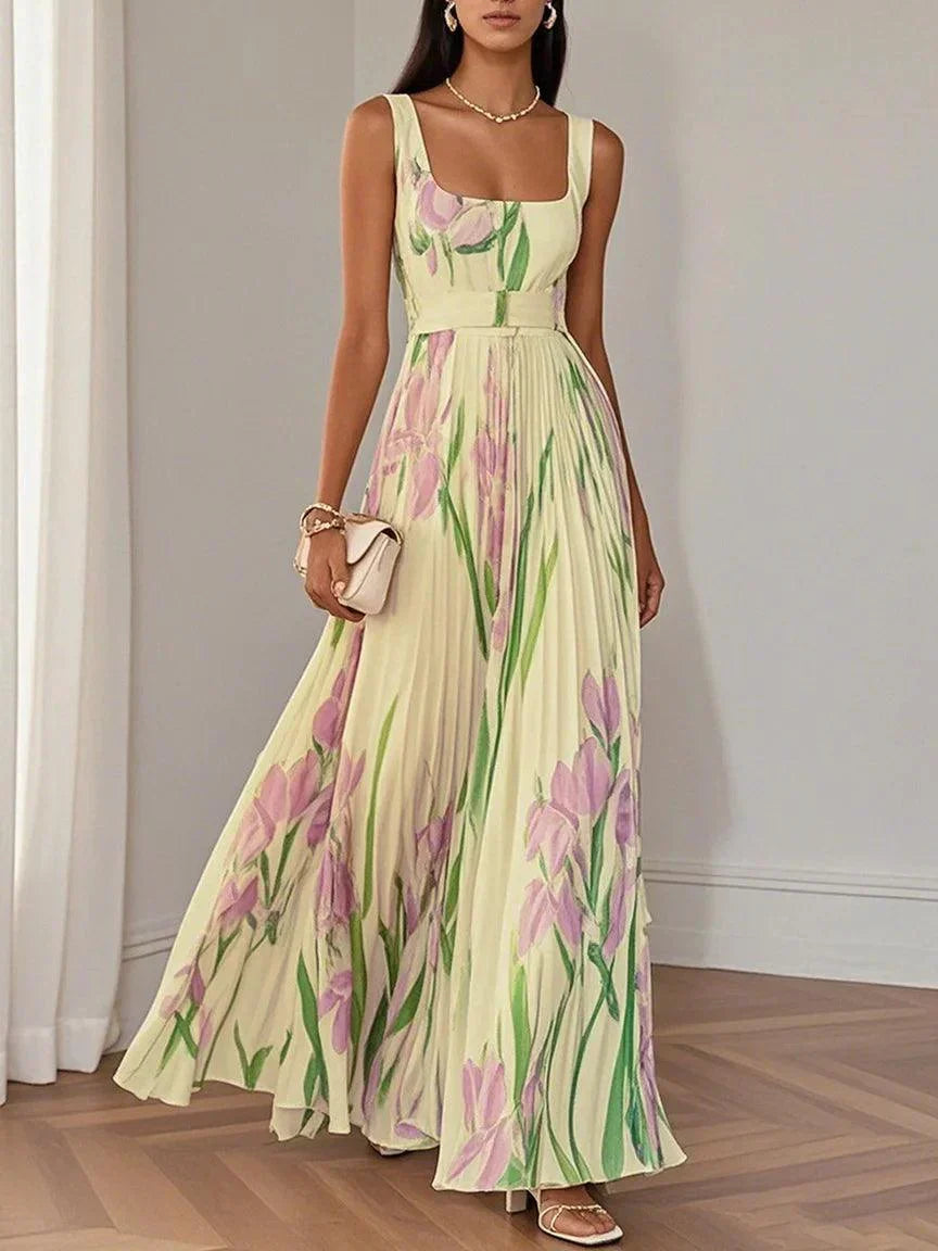 Vestido longo feminino elegante com estampa floral e detalhes plissados. Ideal para moda verão e estilo chic.