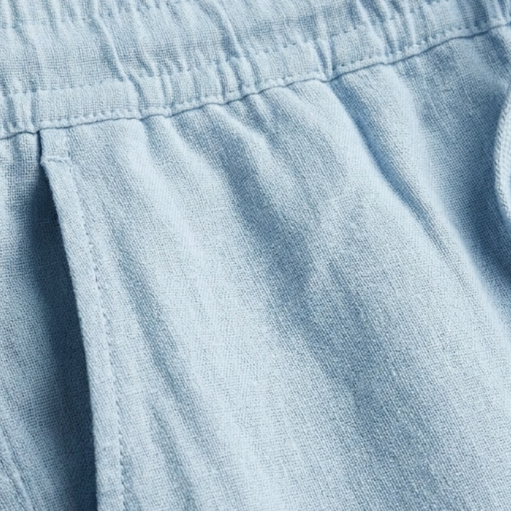 Calças de linho masculinas perna reta bege, cintura elástica. Peça elegante, confortável e casual para o verão.