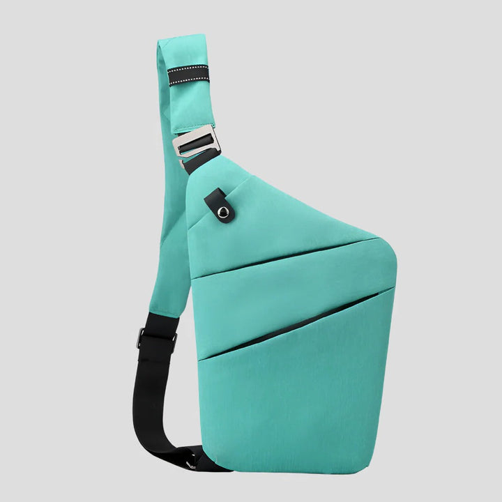 Bolsa de ombro unissexo com sistema antifurto. Material impermeável protege seus itens eletrónicos e documentos.